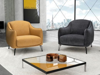 Two armchairs, one yellow-orange and one black.